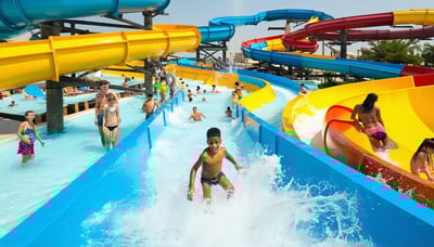 Families and friends enjoying slides and pools at Water Park Dubai Families and friends enjoying slides and pools at Water Park Dubai